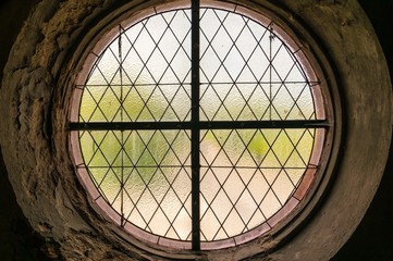 Old rounded window inside the Gothic cathedral of the Virgin Mar