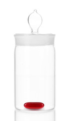 Transparent jar with pill isolated on white
