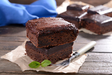 Delicious chocolate cakes on table close-up