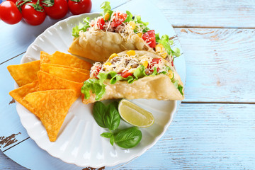 Tasty taco with nachos chips 