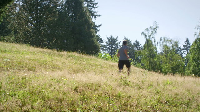 Fit and healthy young man runs through the park
