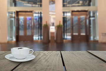 Defocus with terrace wood and cappuccino coffee with escalator