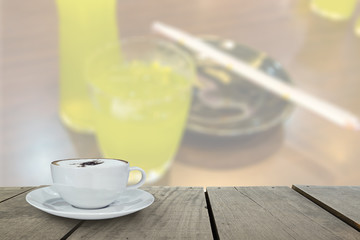 Defocus with terrace wood and cappuccino coffee with green tea