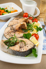 Grilled salmon steaks and vegetables