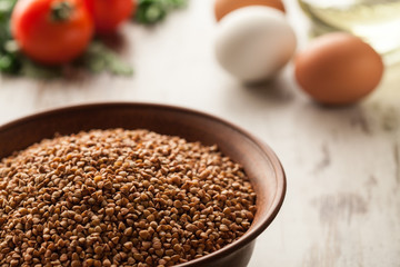 Ceramic bowl with buckwheat.