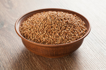 Ceramic bowl with buckwheat.