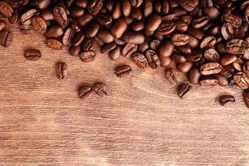 Coffee beans on wooden background