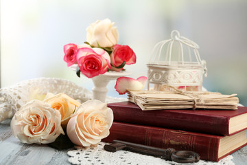 Fresh roses with old book. Vintage concept