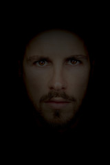 dark portrait of a young beautiful man