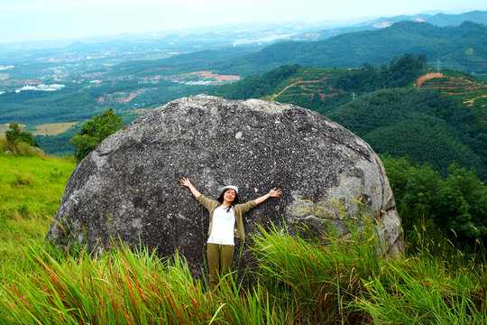Female tourist resting at mountain peak