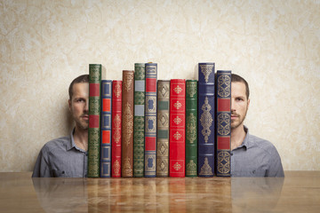 man's face split to hold a stack of books