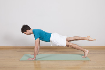 Naklejka premium man practicing pilates indoor, return to life sequence, 34 exerc