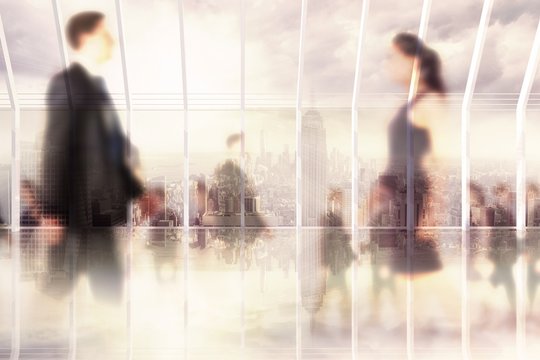 Composite Image Of Business People Walking In A Blur