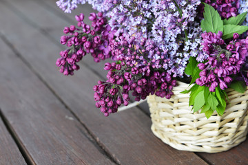 basket with  branch of lilac