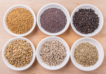 Mix herb and pices in white bowl