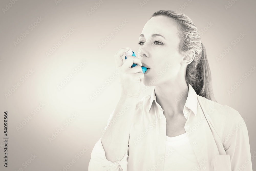 Poster Composite image of pretty blonde using an asthma inhaler