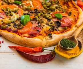Pizza with ham and olives