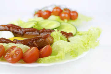 Sausages with ketchup and vegetables