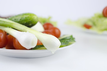 Still life of vegetables in plate