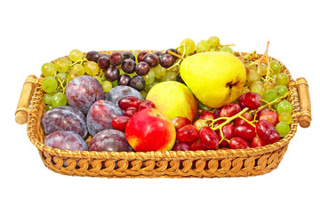 Ripe fruits on a straw pot.Isolated.