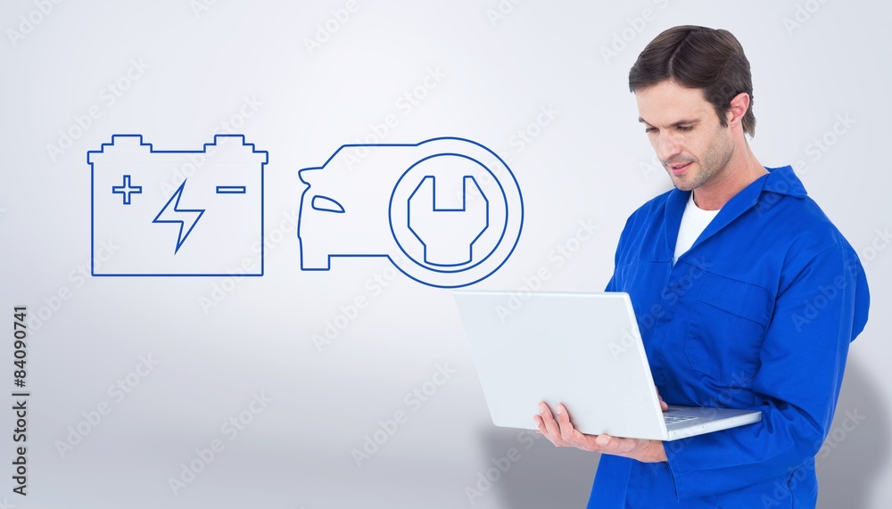 Poster Composite image of mechanic using laptop over white background