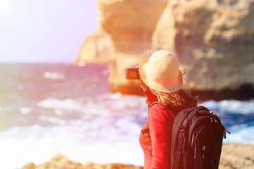 Tourist making photo of Azure Window in Gozo island