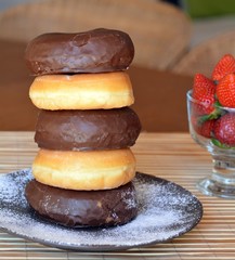 Stack Of Donuts On The Wooden Table
