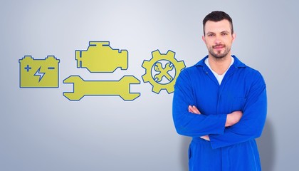 Composite image of mechanic standing arms crossed 