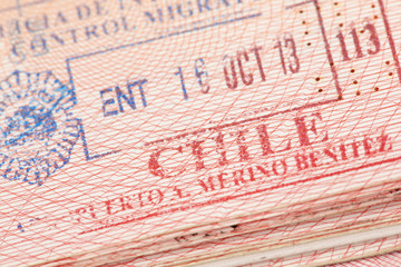 Passport page with Chile immigration control stamp.