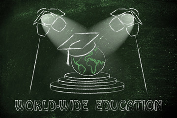 world-wide education: globe with graduation cap under spotlights