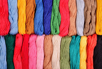Colorful skeins of floss as background texture