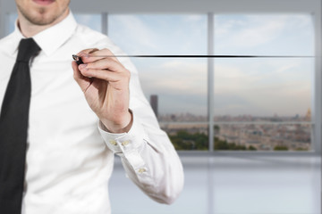 businessman in office drawing line in the air