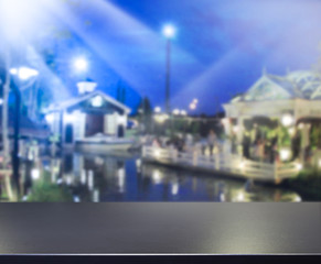 Fototapeta premium Table Top And Blur Building Background