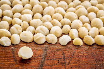 macadamia nuts on rustic wood