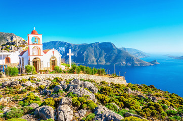 Sea bay on Greek Island with white church - obrazy, fototapety, plakaty