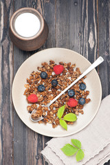 Granola with raspberries and blueberries. top view