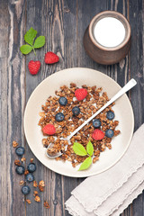 Granola with raspberries and blueberries. top view
