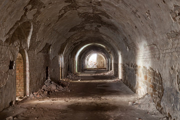 Fototapeta na wymiar Stone destroyed tunnel in fort Tarakanovskiy.