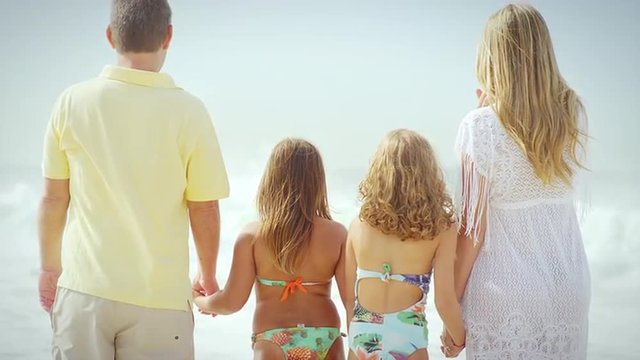 Brazilian family plays together on a beach in Brazil