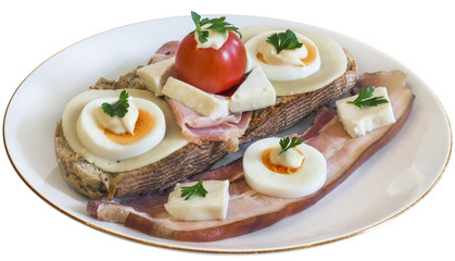 Bacon Cheese Egg Ham and Tomato Sandwich on Plate Isolated.