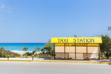 Taxi station near beach and sea in Greece