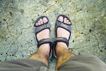 Black sandals on the road