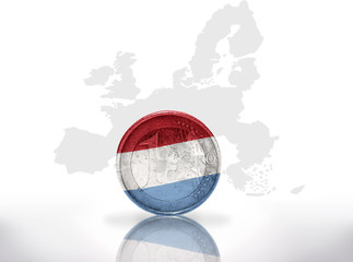 Naklejka premium euro coin with luxembourg flag on european union map background