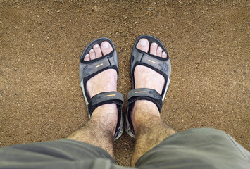 Black sandals on the road