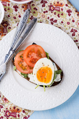 Rye toast sandwiches with egg and soft cheese