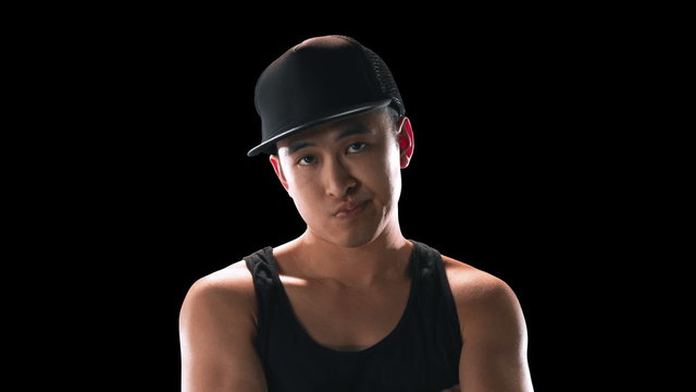 Cool looking break dancer portrait as he spins around slowly