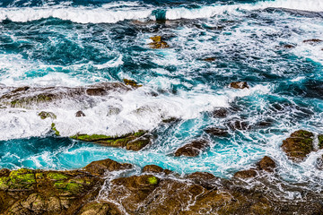 Stones in waves of ocean