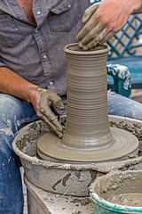 Young artist shaping a clay pot 1