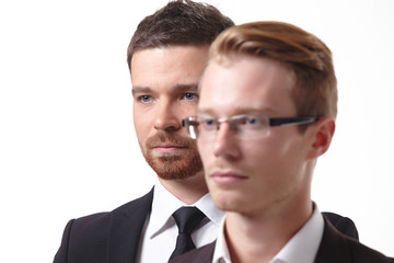 close-up portrait of two young businessmen