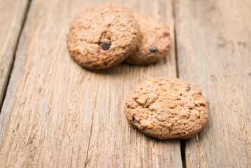 Close up chocolate chip cookies on wood table